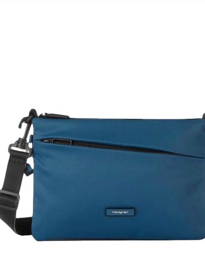 Front of a size O/S Orbit Flat Crossbody in Neptune Blue in Neptune Blue by Hedgren. | dia_product_style_image_id:330689